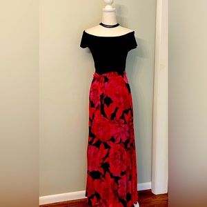 Stunning off the shoulder black top with attached pleated chiffon skirt!